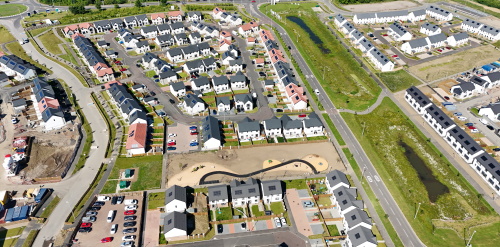 This image: This image shows an aerial photo of another Hargreaves Land residential scheme.
							The map: The map has zoomed into the site location, with the A1077 (M) to the west and Scotter
							Road to the east of the site.